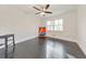 Bedroom with hardwood floors, wainscotting, and natural light at 2419 Edgewater Sw Dr, Atlanta, GA 30311