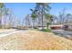Ranch-style home featuring white siding, complemented by a spacious yard with mature trees at 2419 Edgewater Sw Dr, Atlanta, GA 30311