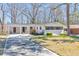 Charming one-story house with modern accents and a well-maintained front yard in a suburban neighborhood at 2419 Edgewater Sw Dr, Atlanta, GA 30311