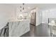 Bright and airy kitchen featuring marble countertops, stainless steel appliances, and an island with seating at 2419 Edgewater Sw Dr, Atlanta, GA 30311