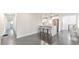 Open floor plan with a kitchen island and bar seating featuring stainless steel appliances and dark floors at 2419 Edgewater Sw Dr, Atlanta, GA 30311