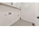 A functional laundry room has overhead cabinets and hookups for a washer and dryer at 2419 Edgewater Sw Dr, Atlanta, GA 30311