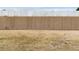 Fenced in back yard with grass and mature privacy fence at 453 Tara Commons Cir, Loganville, GA 30052