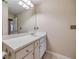 Bathroom featuring a vanity with drawers, sink, mirror, and linoleum flooring at 453 Tara Commons Cir, Loganville, GA 30052