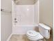 Bathroom showcasing the shower-tub combo and a toilet at 453 Tara Commons Cir, Loganville, GA 30052