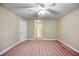 Spacious bedroom with a ceiling fan and ensuite access at 453 Tara Commons Cir, Loganville, GA 30052