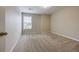 Bedroom featuring neutral carpet, walls, window and one door at 453 Tara Commons Cir, Loganville, GA 30052