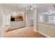Open-concept dining room with view of kitchen and adjacent rooms at 453 Tara Commons Cir, Loganville, GA 30052