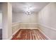 A cozy dining room area with a chandelier and neutral-colored walls at 453 Tara Commons Cir, Loganville, GA 30052