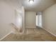 Hallway with neutral carpet and walls leading to bedrooms and bathrooms at 453 Tara Commons Cir, Loganville, GA 30052