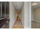 Inviting foyer with hardwood flooring and neutral walls leading to carpeted living spaces at 453 Tara Commons Cir, Loganville, GA 30052