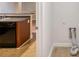 View of the in-unit laundry hookups with tile flooring in a bright room off the kitchen at 453 Tara Commons Cir, Loganville, GA 30052