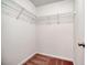 A walk-in closet with hanging storage and carpet flooring at 453 Tara Commons Cir, Loganville, GA 30052