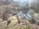 Backyard featuring a wooden deck extending into the pond at 929 Bexhill Dr, Lawrenceville, GA 30043