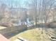 Fenced-in backyard with lush green lawn and mature trees at 929 Bexhill Dr, Lawrenceville, GA 30043