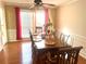 Dining area features a decorative table, wainscoting, and bright natural light at 929 Bexhill Dr, Lawrenceville, GA 30043