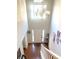 Open foyer with high ceilings, hardwood floors, chandelier, staircase, and view of the front door at 929 Bexhill Dr, Lawrenceville, GA 30043