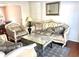 Bright living room featuring stylish furniture, elegant decor, and hardwood floors at 929 Bexhill Dr, Lawrenceville, GA 30043