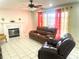 Inviting living room with tile flooring, fireplace, ceiling fan, and comfortable seating at 929 Bexhill Dr, Lawrenceville, GA 30043