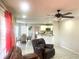 Open-concept living area flowing into the breakfast nook and kitchen beyond at 929 Bexhill Dr, Lawrenceville, GA 30043