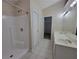 Bathroom featuring a standalone shower, double sink vanity, and tiled floors at 983 Noble Oak Ct, Lawrenceville, GA 30046