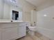 Clean, bright bathroom features a tile floor, tub-shower combo and vanity at 983 Noble Oak Ct, Lawrenceville, GA 30046