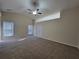Bright bedroom with ceiling fan, plush carpet, and vaulted ceiling at 983 Noble Oak Ct, Lawrenceville, GA 30046