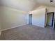 Cozy, carpeted bedroom with an closet and open entry to an en suite bathroom at 983 Noble Oak Ct, Lawrenceville, GA 30046