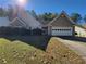 Charming single-story home with a well-manicured lawn and inviting entrance, showcasing its appealing curb appeal at 983 Noble Oak Ct, Lawrenceville, GA 30046