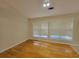 Bright living room featuring hardwood floors and large windows at 983 Noble Oak Ct, Lawrenceville, GA 30046