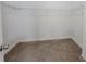 Walk-in closet with neutral carpet and metal storage racks at 983 Noble Oak Ct, Lawrenceville, GA 30046