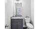 This bathroom features a gray vanity with granite counters, modern fixtures, and a stylish mirror at 3139 Stonegate Sw Dr, Atlanta, GA 30331
