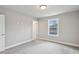 Cozy bedroom features carpet, a window with natural light, and neutral colored walls with white trim at 3139 Stonegate Sw Dr, Atlanta, GA 30331