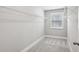 Walk-in closet with carpet floors, wire shelving, base trim, and a window providing natural light at 3139 Stonegate Sw Dr, Atlanta, GA 30331