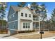 Beautiful two-story home with a charming front porch, a landscaped yard, and great curb appeal at 3139 Stonegate Sw Dr, Atlanta, GA 30331