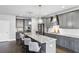 Stylish kitchen featuring granite countertops, stainless steel appliances, pendant lighting, and ample storage space at 3139 Stonegate Sw Dr, Atlanta, GA 30331