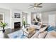 Cozy living room with a fireplace, shiplap accent wall, comfortable seating, and natural light at 3139 Stonegate Sw Dr, Atlanta, GA 30331