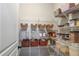 Walk-in pantry with wire shelving provides ample storage space for food and kitchen essentials at 8605 Gladden Ln, Suwanee, GA 30024