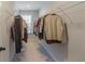 Spacious walk-in closet with wire racks offers plenty of room for clothing and accessories at 8605 Gladden Ln, Suwanee, GA 30024