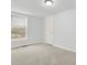 Bedroom with neutral walls and carpet, bright window, and closet at 10 Creek Se Dr, Cartersville, GA 30121