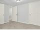 Bedroom with 3 doors and neutral carpet and walls at 10 Creek Se Dr, Cartersville, GA 30121