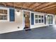 View of the front doorway and covered porch which leads into a spacious, light-filled interior at 10 Creek Se Dr, Cartersville, GA 30121