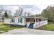 Attractive home with an expansive front porch and eye-catching blue shutters providing curb appeal at 10 Creek Se Dr, Cartersville, GA 30121