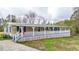 Inviting single-story home with a spacious porch, showcasing blue shutters, white railing, and an American flag at 10 Creek Se Dr, Cartersville, GA 30121