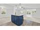 Kitchen island featuring granite countertops and dark blue cabinetry, perfect for casual dining and food preparation at 10 Creek Se Dr, Cartersville, GA 30121