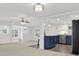 A neutral open concept living room that flows into the kitchen with a center kitchen island at 10 Creek Se Dr, Cartersville, GA 30121