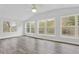 Bright sunroom featuring hardwood floors, multiple windows, and neutral paint, ideal for relaxing at 10 Creek Se Dr, Cartersville, GA 30121