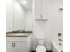 Clean white bathroom featuring a sink with quartz countertop, and tiled shower at 241 Maynard Se Ter # 15, Atlanta, GA 30316