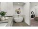 Sleek modern bathroom featuring a soaking tub and dual sink vanity at 241 Maynard Se Ter # 15, Atlanta, GA 30316