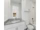 Well-lit bathroom featuring white cabinets, grey countertops and a view to the exterior at 241 Maynard Se Ter # 15, Atlanta, GA 30316